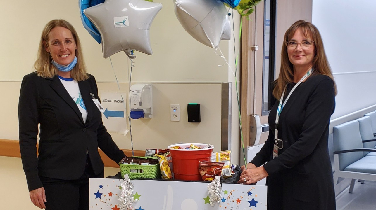 Executives delivery candy to workers at Eagle Ridge Hospital