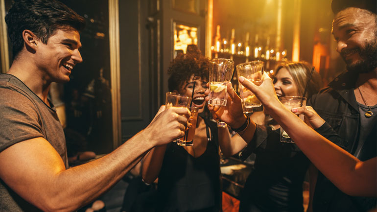 group of friends having drinks at the bar