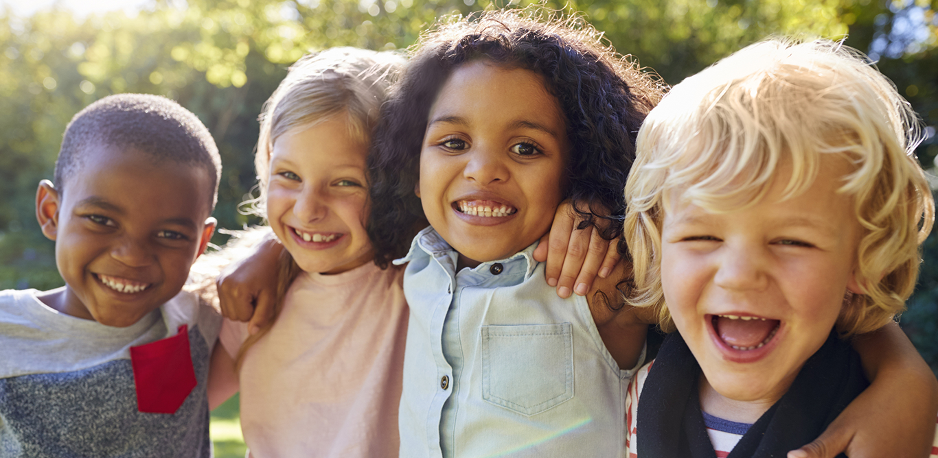 Four happy smiling kids