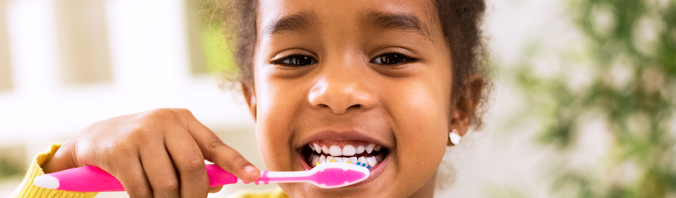 Girl brushing her teeth