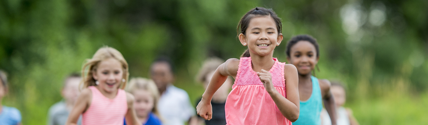 Group of children running on a field