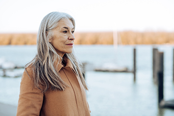 Thoughtful mature woman looking at the distance