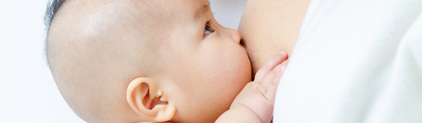 Asian baby breastfeeding