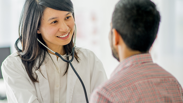 Asian doctor with patient