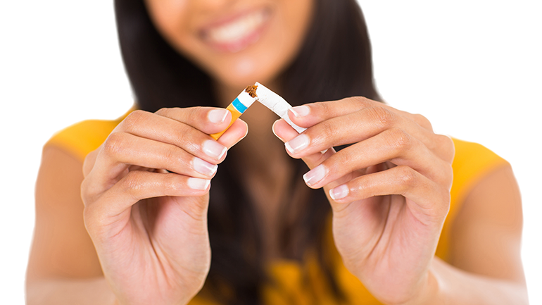 Woman breaking cigarette