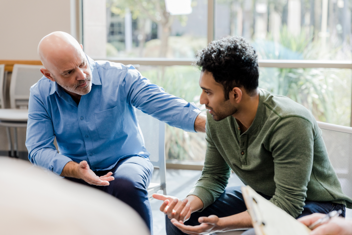 Two men talking about mental health