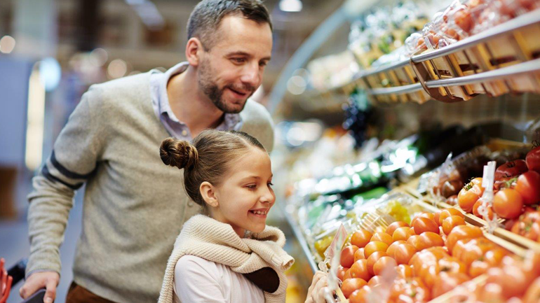 father and daughter produce shopping