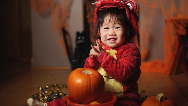 Child in dragon costume for Halloween