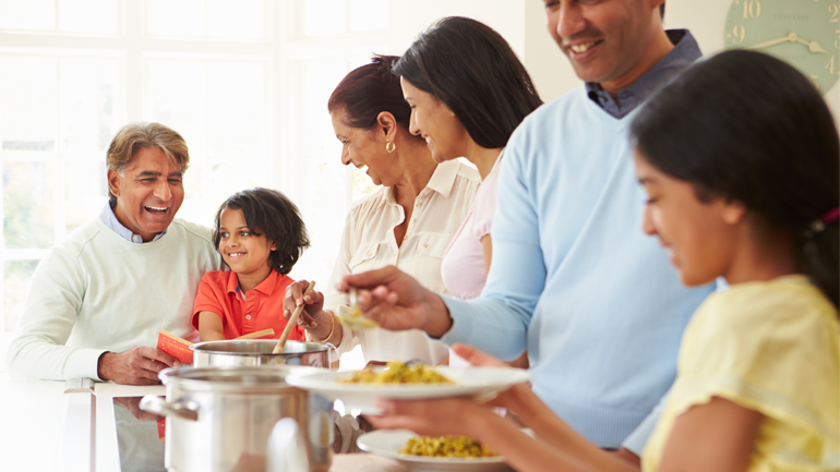 South Asian family eating a meal together