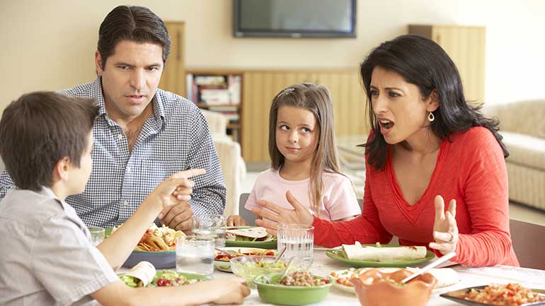 Mother and son arguing during mealtime