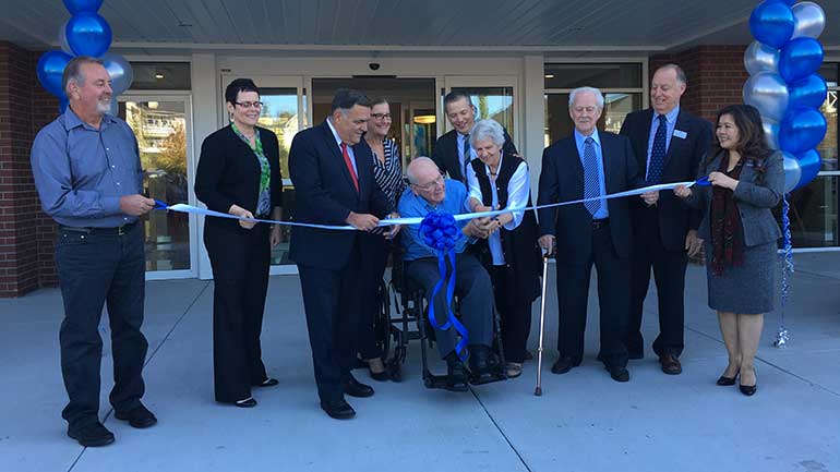 Cutting ribbon of the newly opened Harrison West at Elim Village