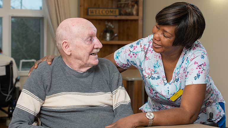 Nurse and a senior is having fun with their conversation