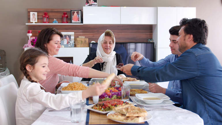 Family having an Iftar meal to celebrate Ramadan