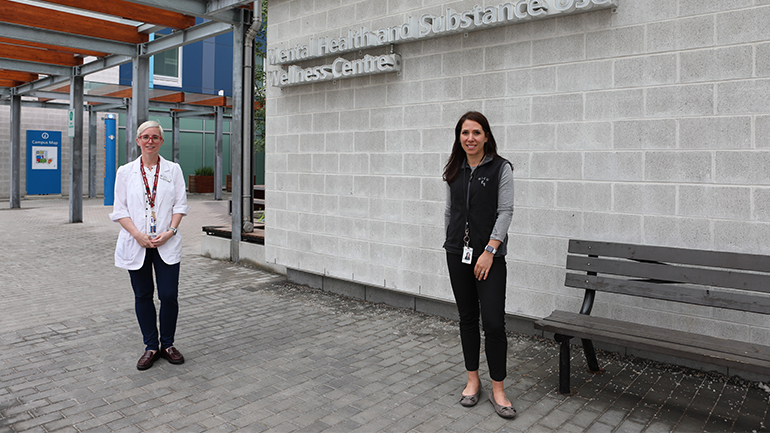 Sarah Kaufman standing on the left side and Sarah Rourke standing on the far right