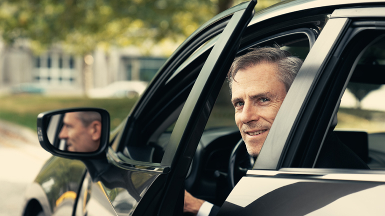 Tobin opening his car door slightly