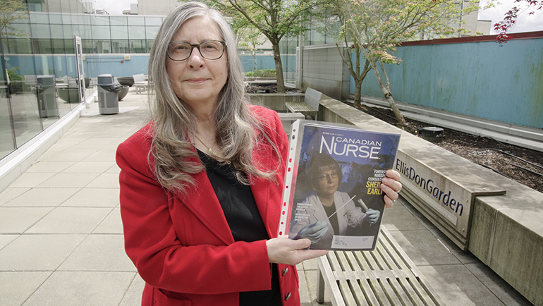 Sheila Early holding magazine