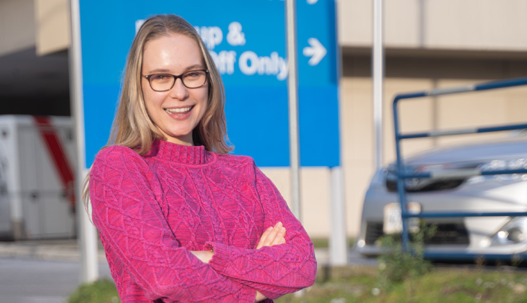 Doctoral student Marlena Ornowska stands outside of Royal Columbian Hospital