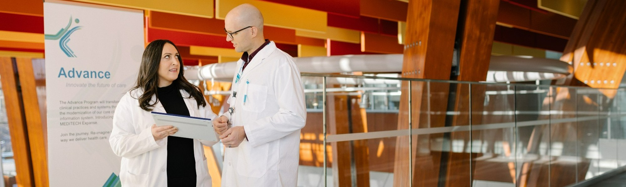 Doctors consulting while using a tablet