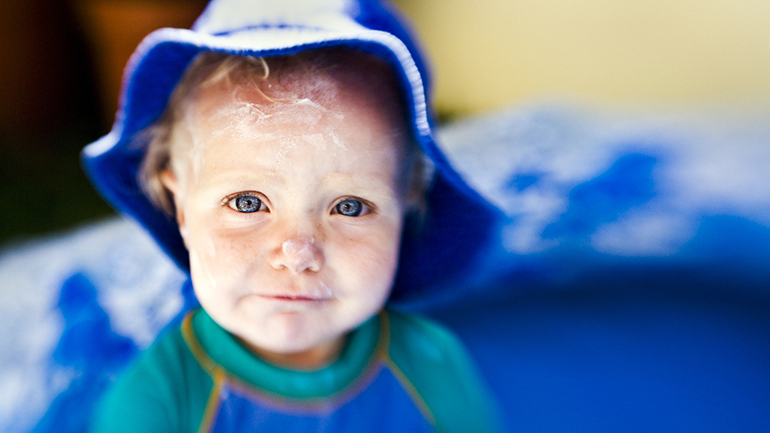 Baby boy with sunscreen