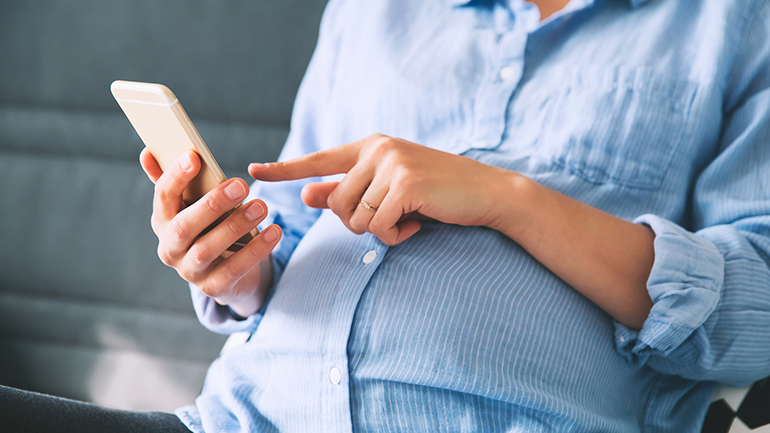 pregnant woman with smartphone