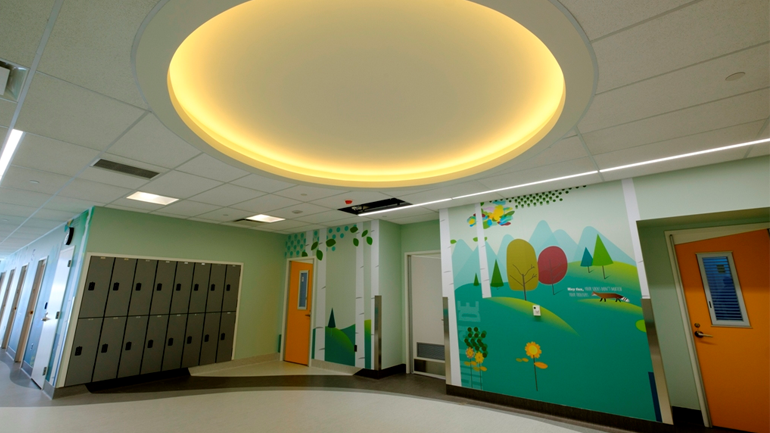 Hospital area with lockers and art on the wall