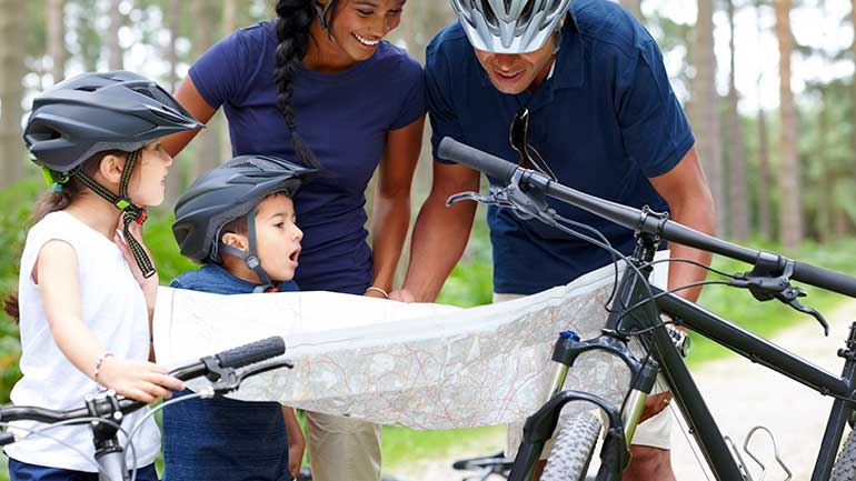 Family biking at a park