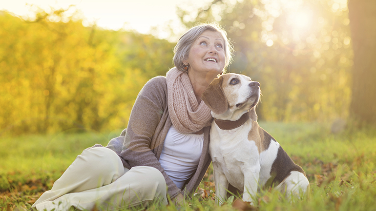 Senior with her dog at a park