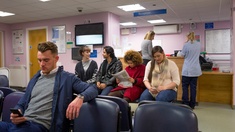 People waiting at the emergency area of the hospital