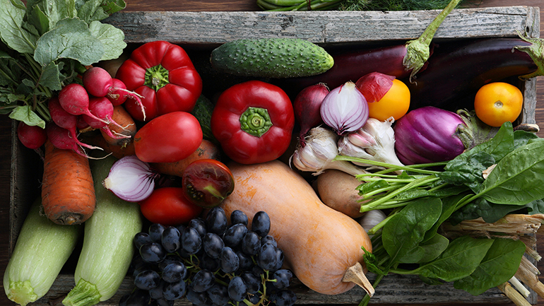 Different kinds of vegetable in a wooden box