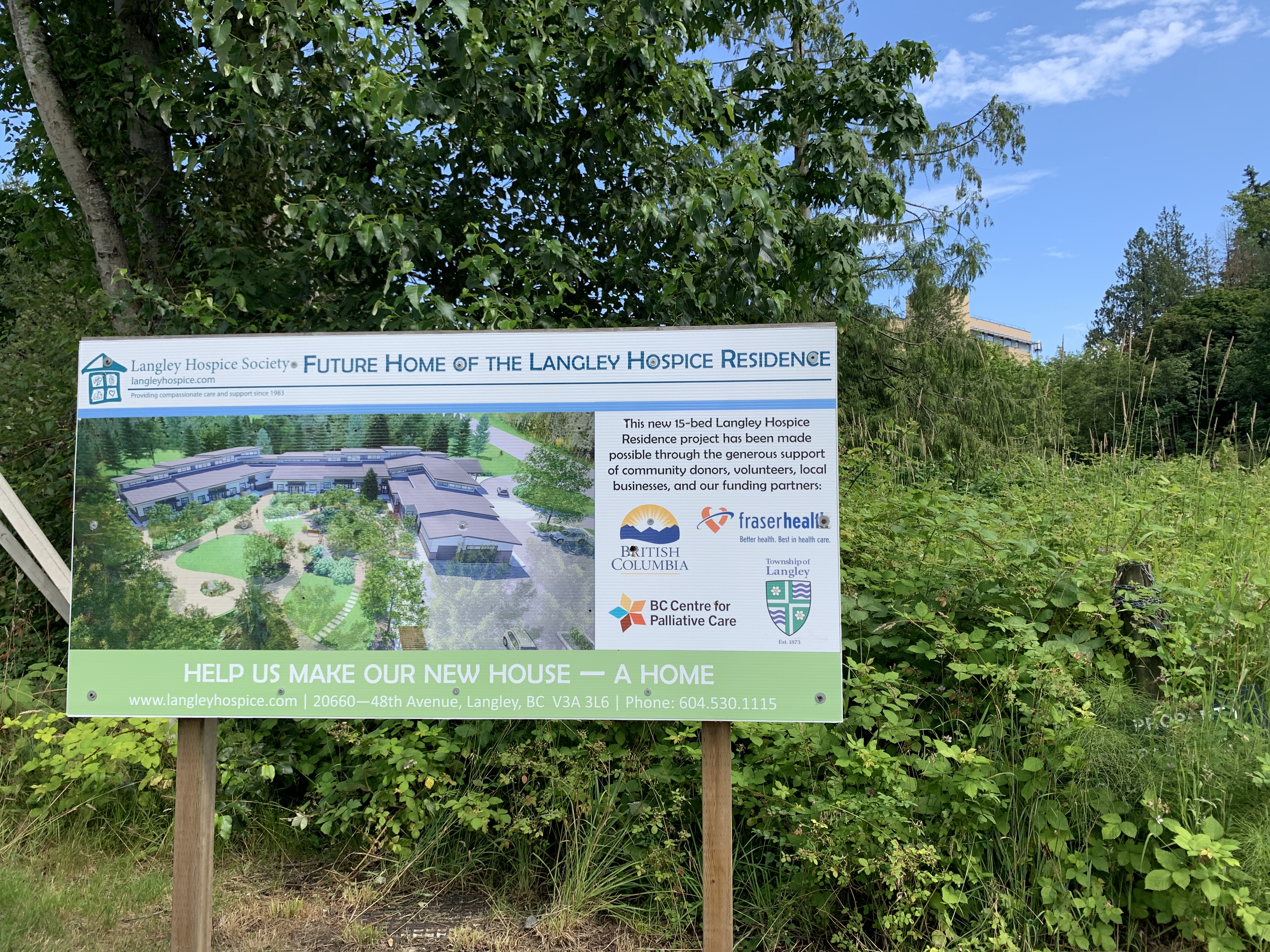A sign on the site describing the Langley Hospice