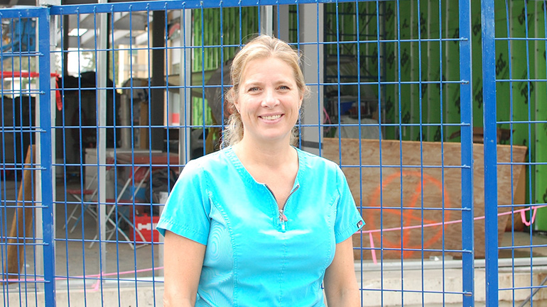 Kathy Boettcher stands outside the area currently under construction that will become the new larger emergency department at Langley Memorial Hospital. Kathy Boettcher at Langley Memorial