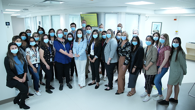 Group of masked people standing in building